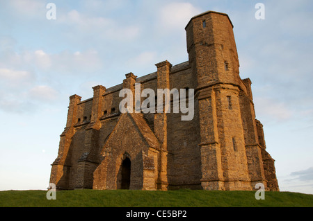 The medieval St Catherines Chapel on top of Chapel Hill, catching the last rays of the setting sun, at Abbotsbury in Dorset. England, United Kingdom. Stock Photo