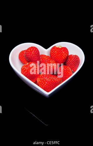 Strawberries in heart shaped bowl Stock Photo
