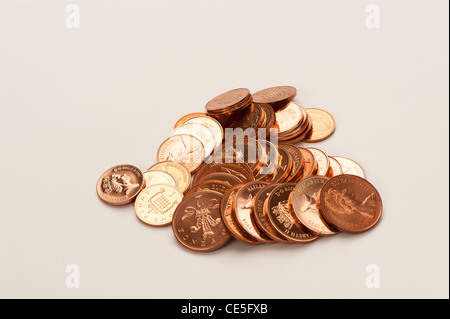 a pile of English copper coins on white background Stock Photo