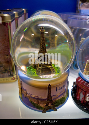Eiffel Tower souvenir / gift snow dome, for sale in the tourist gift shop in Paris. France Stock Photo