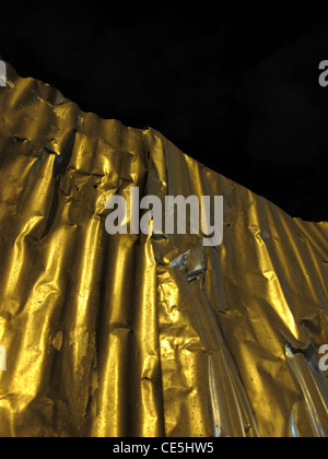 old high corrugated iron sheets fence outdoors at night Stock Photo