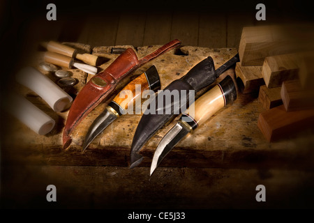 Handmade knife with a bone and wood handle and leather sheath. Stock Photo