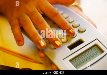 working on calculator ; MR#201 Stock Photo