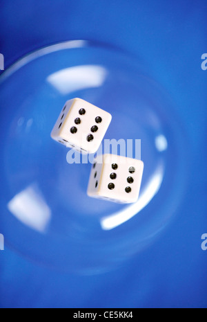 two dice dices 6 six sixes pair on blue background Stock Photo