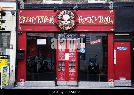 West End Charing Cross Road Soho London The Crobar Beer n Whisky Rock n Roll bar venue signs skull windows doors Manette Street entrance street scene Stock Photo