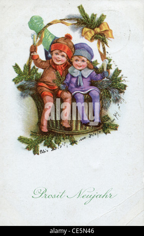 GERMANY - CIRCA 1937: Vintage postcard, greeting the New Year, happy kids shows and Christmas decorations, circa 1937 Stock Photo