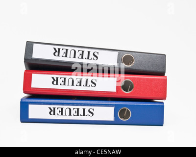 three colored files on top of each other with the German label "Steuer"(Tax) Stock Photo
