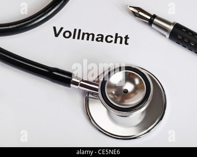 a Stethoscope and a fountain pen on sheet of paper with the word 'Procuration' in German Stock Photo