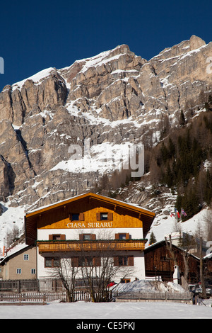 House in front of the Sella massif, Kolfuschg, Colfosco, Gader valley, Val Badia, Alta Badia, Dolomites, South Tyrol, Italy Stock Photo