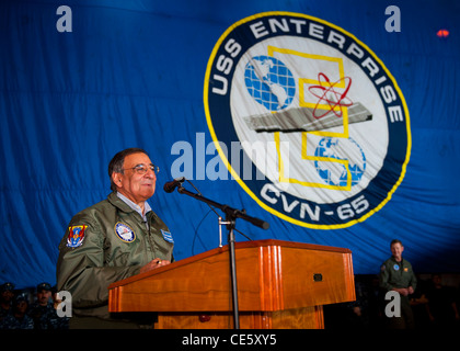 US Secretary of Defense Leon E. Panetta speaks to Sailors and Marines in the hangar bay of the aircraft carrier USS Enterprise January 21, 2012 sailing the Atlantic. The Enterprise Carrier Strike Group is underway conducting a composite training unit exercise. Stock Photo