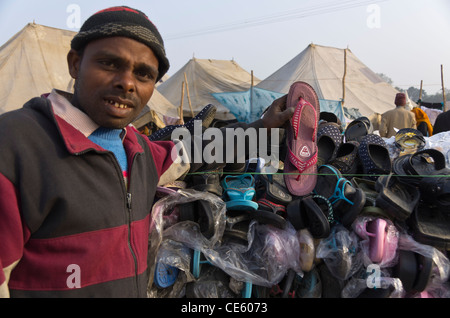 a shoe salesman at Magh Mela, Sangam, Allahabad, India Stock Photo