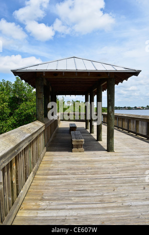 Florida Park Boardwalk and Benches along Waterway Stock Photo