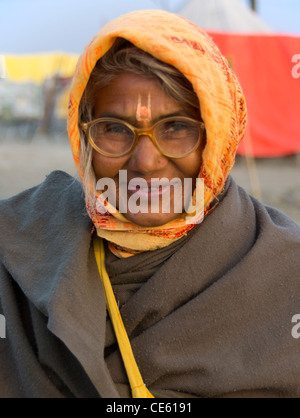 happy mature woman pilgrim at Magh Mela, Sangam, Allahabad, India Stock Photo