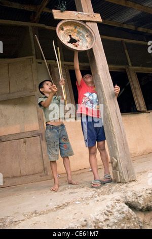 Primary school children ringing the bell in the playground Stock Photo ...