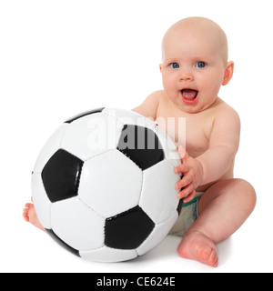 Cute caucasian baby playing with soccer ball. All on white background. Stock Photo