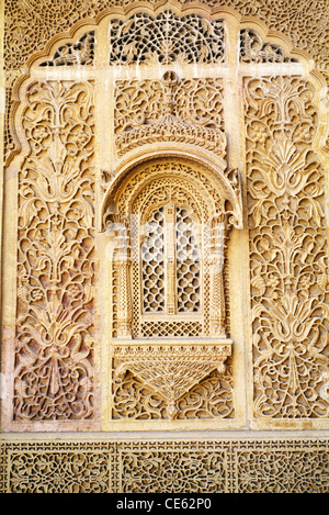 closed window jali jharokha yellowstone lattice work wall Jaisalmer Rajasthan India Stock Photo