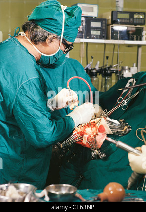 Surgeons performing brain surgery ; India : asia Stock Photo