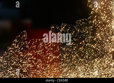 Shattered glass ; broken glass ; broken into very small pieces ; India ; Asia Stock Photo