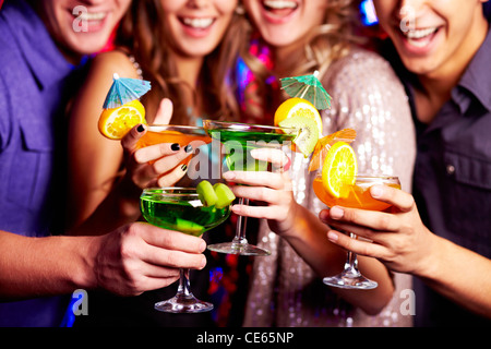 Close-up of fresh cocktails in friends hands Stock Photo