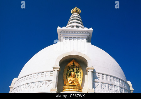 Golden idol of Buddha on Vishwa Shanti stupa ; Rajgir ; Bihar ; India Stock Photo