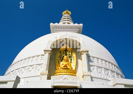 World Peace Stupa ; Golden idol of Buddha on Vishwa Shanti stupa ; Rajgir ; Girivraj ; Nalanda district ; Bihar ; India ; Asia Stock Photo