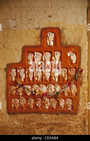 Sati handprints mural to mark self immolation by woman at Loha Pol, Iron Gate ; Mehrangarh Fort Palace and Museum ; Jodhpur ; Rajasthan ; India ; Asia Stock Photo