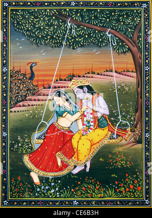 Radha Krishna on swing jhoola miniature painting on paper Stock Photo