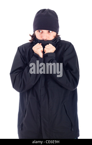 Man wrapped up in winter jacket freezing, isolated on white background. Stock Photo
