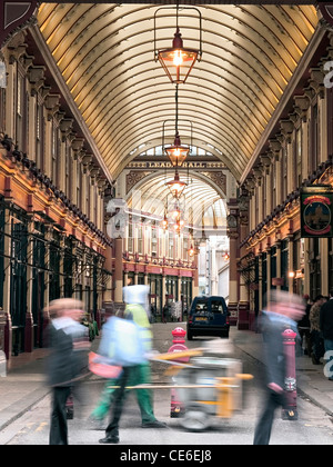 entrance to Leadenhall in London with a street cleaner and pedestrians Stock Photo