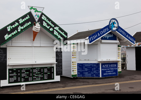 Closed and deserted food stalls during winter in West Bay, Dorset, England. Stock Photo