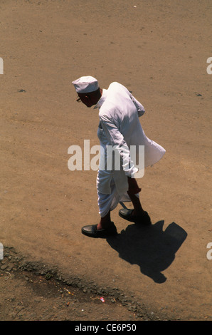Top view of old man in white dress dhoti kurta and gandhi cap topi Mumbai India Stock Photo