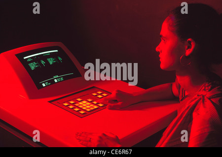 Woman working on computer in control room Stock Photo