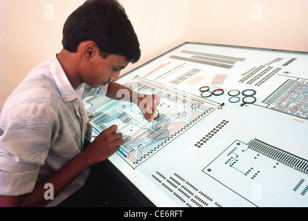 man working in electronic industry India Indian modern factory PCB printed circuit board Stock Photo
