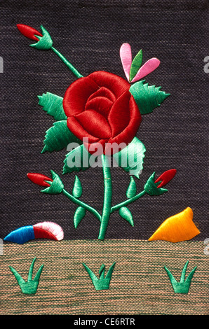 BDR 85069 : embroidery on cloth of red rose green leaf handicrafts india Stock Photo