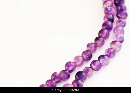 Amethyst Japa Mala prayer beads on white background Stock Photo
