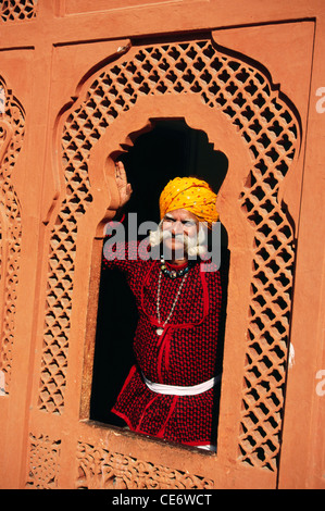 BDR 83374 : indian rajasthani man looking out of a window jaipur rajasthan india MR#657 Stock Photo