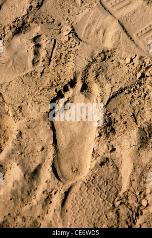 Footsteps in sand Stock Photo