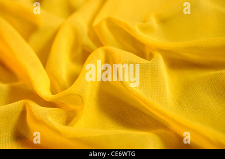Yellow georgette fabric cloth textile texture background doublespread Stock Photo