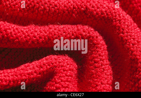 Red woollen knitted fabric Stock Photo