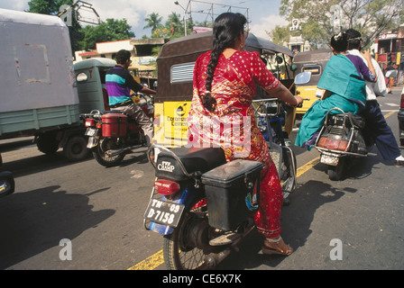 HMA 85451 : indian women in saree driving motorbike traffic on road madras chennai  tamil nadu india Stock Photo