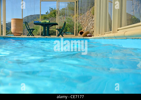 Luxury indoor swimming pool in the mountains in the summer holiday season Stock Photo