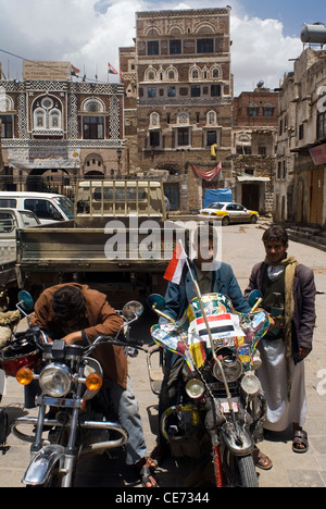 Men on motorbike in the old city of Sana'a, a UNESCO World Heritage Site, Yemen, Western Asia, Arabian Peninsula Stock Photo