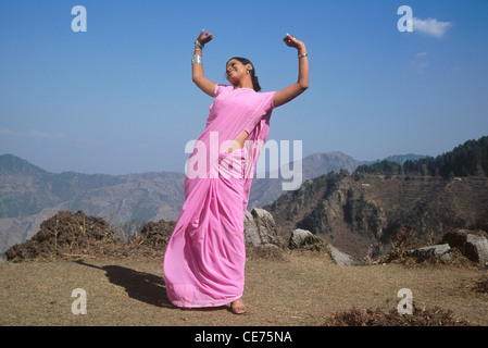 RSC 84665 : indian women in pink saree dancing on mountain top in hindi bhojpuri Film My dear mother India MR#542 Stock Photo