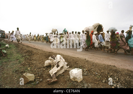 RVA 83177 : tired man sleeping on roadside in pandharpur festival procession ; maharashtra ; india Stock Photo