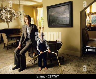 Interior decorator and designer David Mlinaric at home with his son Max Stock Photo