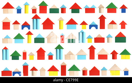 Symbol image. Living in a town, city, village, housing. Colorful building blocks, made of wood. Toys. Stock Photo