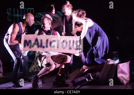 The School for Scandal opens at the Barbican Theatre. Actors holding up 'malicious' sign Stock Photo