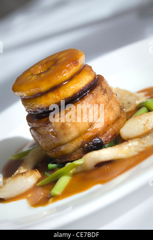 Pot Roast local Welsh Pork with Caramelized Apple and Welsh cider sauce Stock Photo