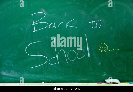 Back to school text on the blackboard Stock Photo