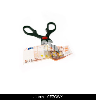 opened stainless scissors cutting euro bill crisis metaphore closeup isolated on white Stock Photo